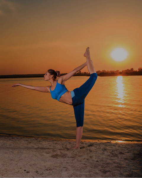 woman stretching on beach
